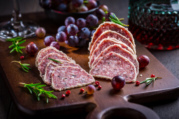 Saltufo - Italian salami delicacy, salami with summer truffle coated with Parmesan cheese with red...