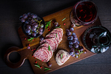 Saltufo - Italian salami delicacy, salami with summer truffle coated with Parmesan cheese with red wine and grapes