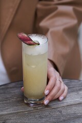 Refreshing cocktail glass with cucumber slice.