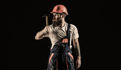 Builder in helmet, hammer, handyman, builders in hardhat. Hammer hammering. Bearded builder...