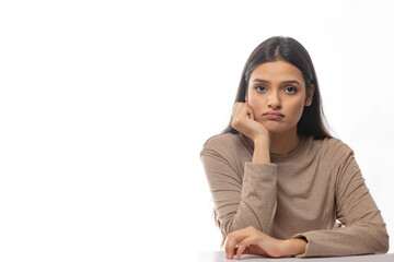 Portrait of a woman making a sad face 	