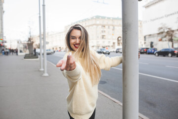 Attractive young woman on urban background.