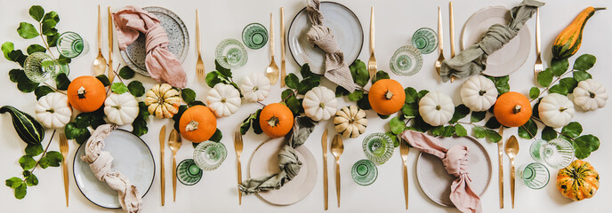 Autumn Thanksgiving festive table decoration setting for Fall gathering or family party. Flat-lay...