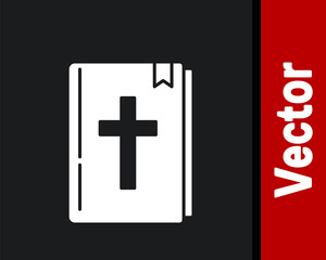 Fototapeta premium White Holy bible book icon isolated on black background. Vector.