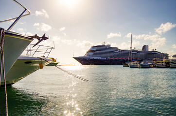 Gigantic modern luxury Holland America cruiseship or HAL cruise ship liner in port of Oranjestadt,...