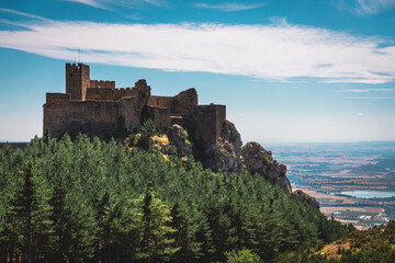 Fototapeta na wymiar Landscape of an ancient stone romanic castle on the mountain