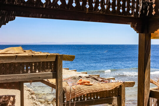 Egypt, Sinai Peninsula - 02/05/2015: People relaxing on the beach and in the beach cafe. Local residents.
