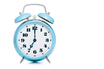 Classic table alarm clock light blue on a white background