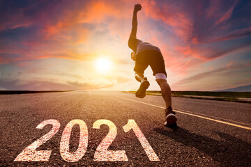 man running and sprinting on road with 2021 new year concept