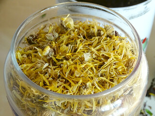 dried flowers of calendula officinalis in a jar