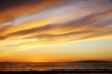 Naklejka na ściany i meble Beautiful sunset over the sea during summertime