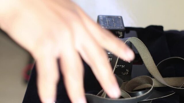 08-05-2020. jerusalem- israel. A Jewish man folds the tefillin into their plastic box (written to the editor in Hebrew - and you tied a letter on your hands - a verse from the Bible)