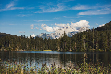 Hintersee in berchtesgaden bavaria. Scenic lake featuring boat rentals, surrounded by forests, hiking paths & mountain peaks