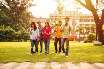 Education is fun - Cheerful Indian asian young students enjoying togetherness in college campus