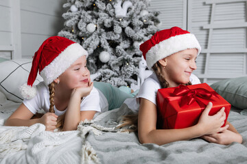 Girl with a Christmas present in a box