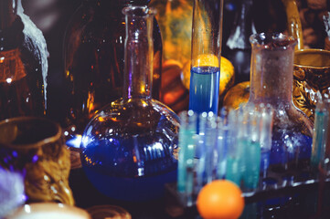 Fototapeta na wymiar glass bottles and candles of Halloween