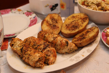 fried potatoes with fried meat on a plate