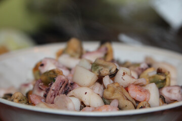 boiled seafood on a plate mussels shrimp octopus