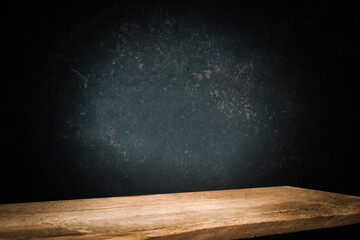 dark wall background. Empty workplace, in front of an abstract package.