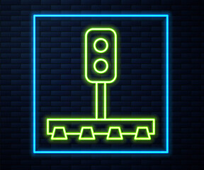 Glowing neon line Train traffic light icon isolated on brick wall background. Traffic lights for the railway to regulate the movement of trains. Vector.