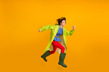 Fototapeta na wymiar Full length photo portrait of woman running jumping up isolated on bright yellow colored background