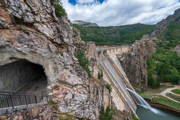 Profile view of dam spillway and tunnel on the road