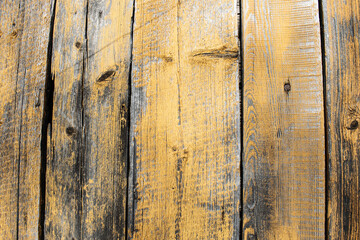 Background from the texture of an old wooden house. The vertical boards.