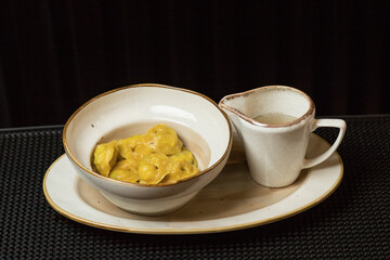 Fresh and hot dumplings with bouillon