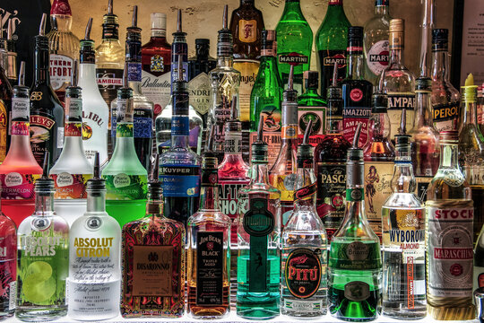 Bottles Of Various Liquors Lines On A Shelf