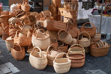 Group of empty wicker baskets for sale in a market place
