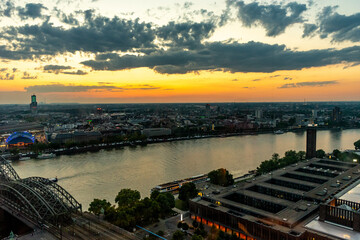 Germany, Cologne, a body of water with a city in the background