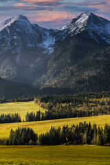 Snow Covered Tatra Mountains and Colorful Trees Foliage and Pasture at Autumn