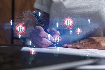 World map and a woman signing papers. Double exposure.