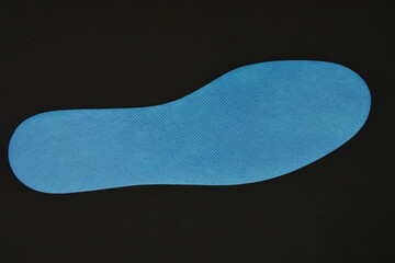 Blue Shoe Insoles on a black background