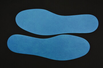 Blue Shoe Insoles on a black background