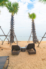 beach chair with palm tree on beach