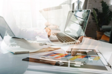 Fototapeta premium Businesswomen hands working with finances about cost and calculator and laptop with tablet, smartphone at office in morning light
