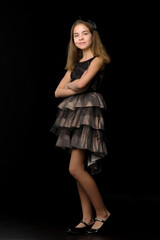 Beautiful young teen girl studio photo on black background