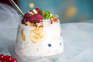Berry fruit parfait in a glass cup closeup