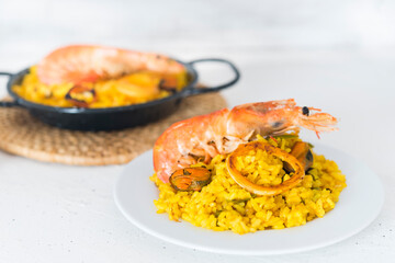 Paella typical spanish food in granite background