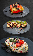 Set of salads on a dark background. Grilled vegetables, eggplant rolls, salad with crab meat