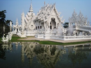 Exploring the Wat Rong Khun (White Temple) in Chiang Rai and the beaches and limestone cliffs of...