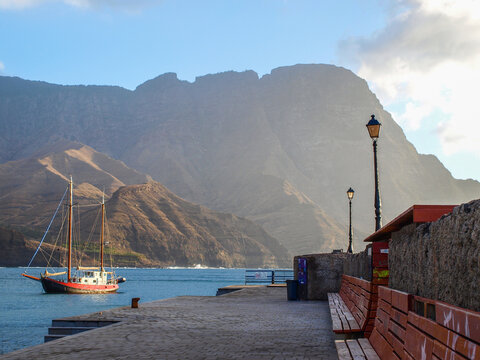 High Cliffs At The Shore And Sailing Boat At Gran Canaria, Canary Islands, Spain (no People)