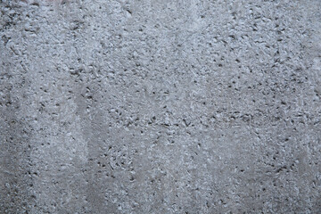 Grey textured concrete wall background with copy space