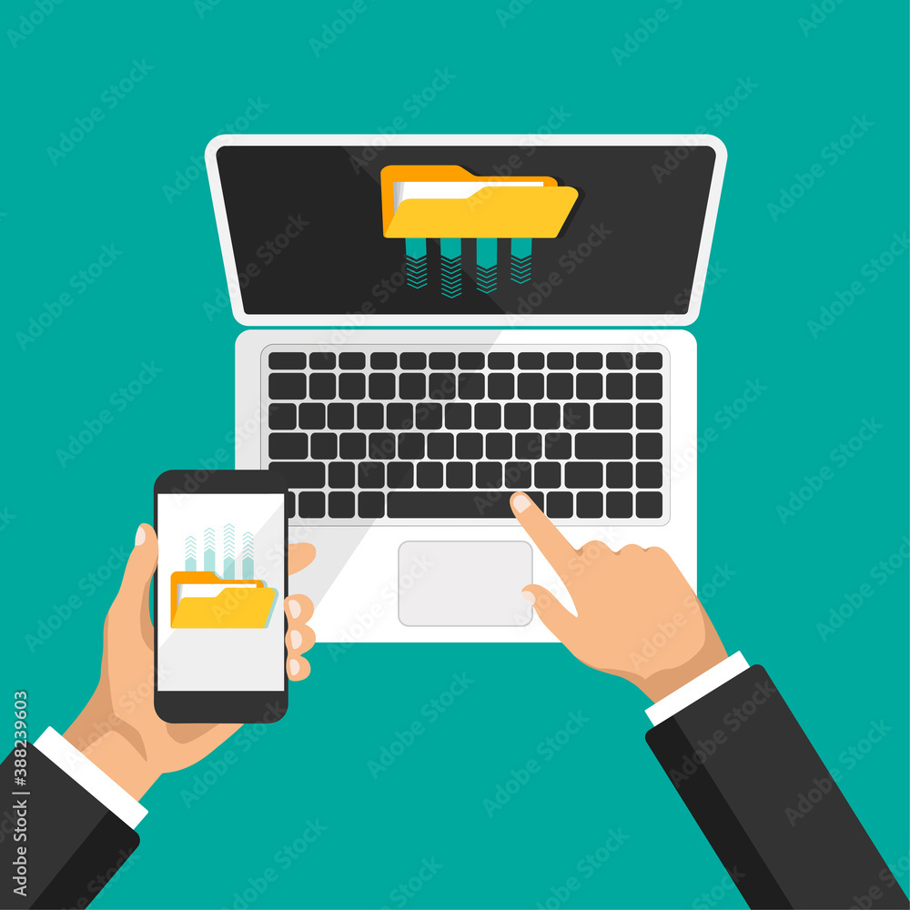 Poster hand holds phone and clicks on laptop keyboard. businessman uploads files to cloud storage or comput