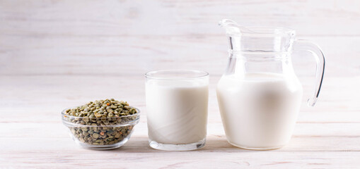 Vegetable pea milk in a bottle and peas in a jar. Gluten free, lactose free product. Banner