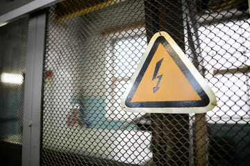 The triangular yellow sign of the danger of electric shock