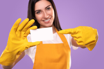 Friendly maid showing blank card