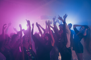 Obraz na płótnie Canvas Photo of big group many classy fancy chic raise hands funny neon bright pink spotlight modern club indoors