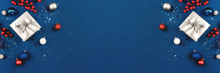 Blue Christmas background of gift box and decorations. The concept of the winter holidays. Flat lay, top view, copy space.